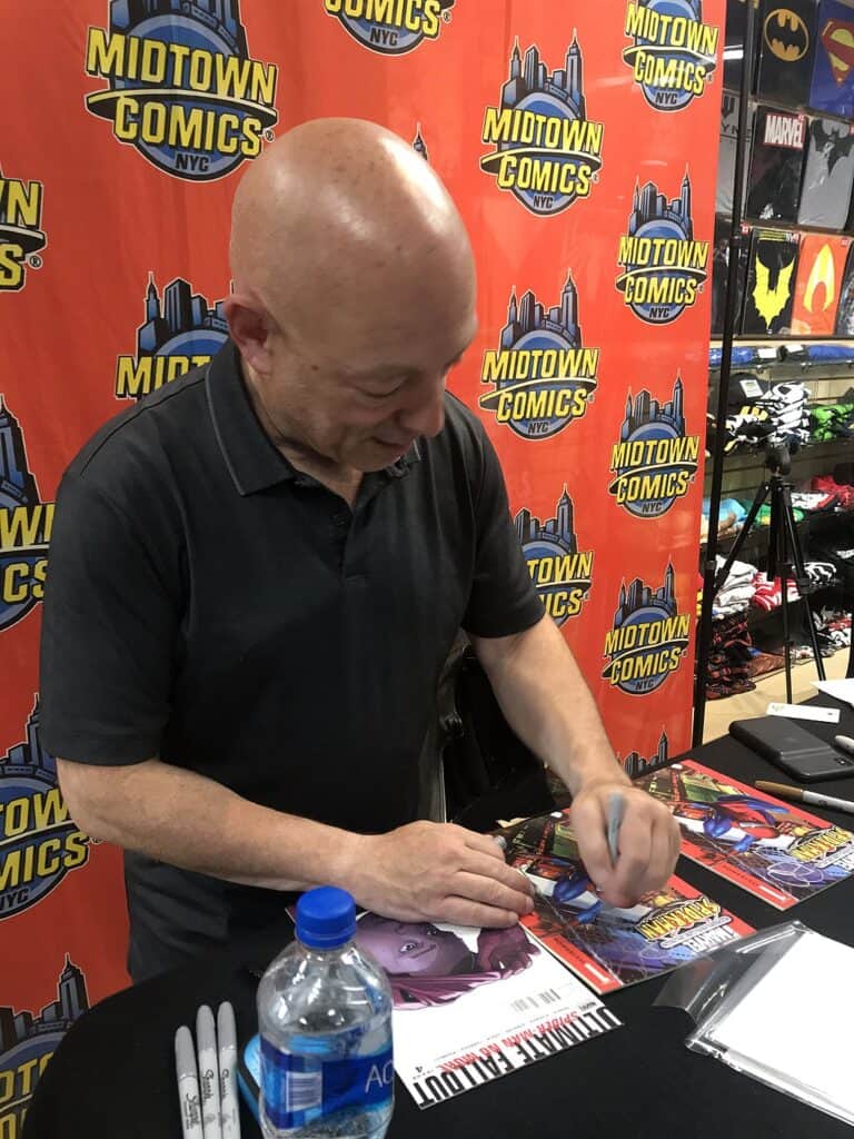 Michael Bendis signs copies of Ultimate Fallout 